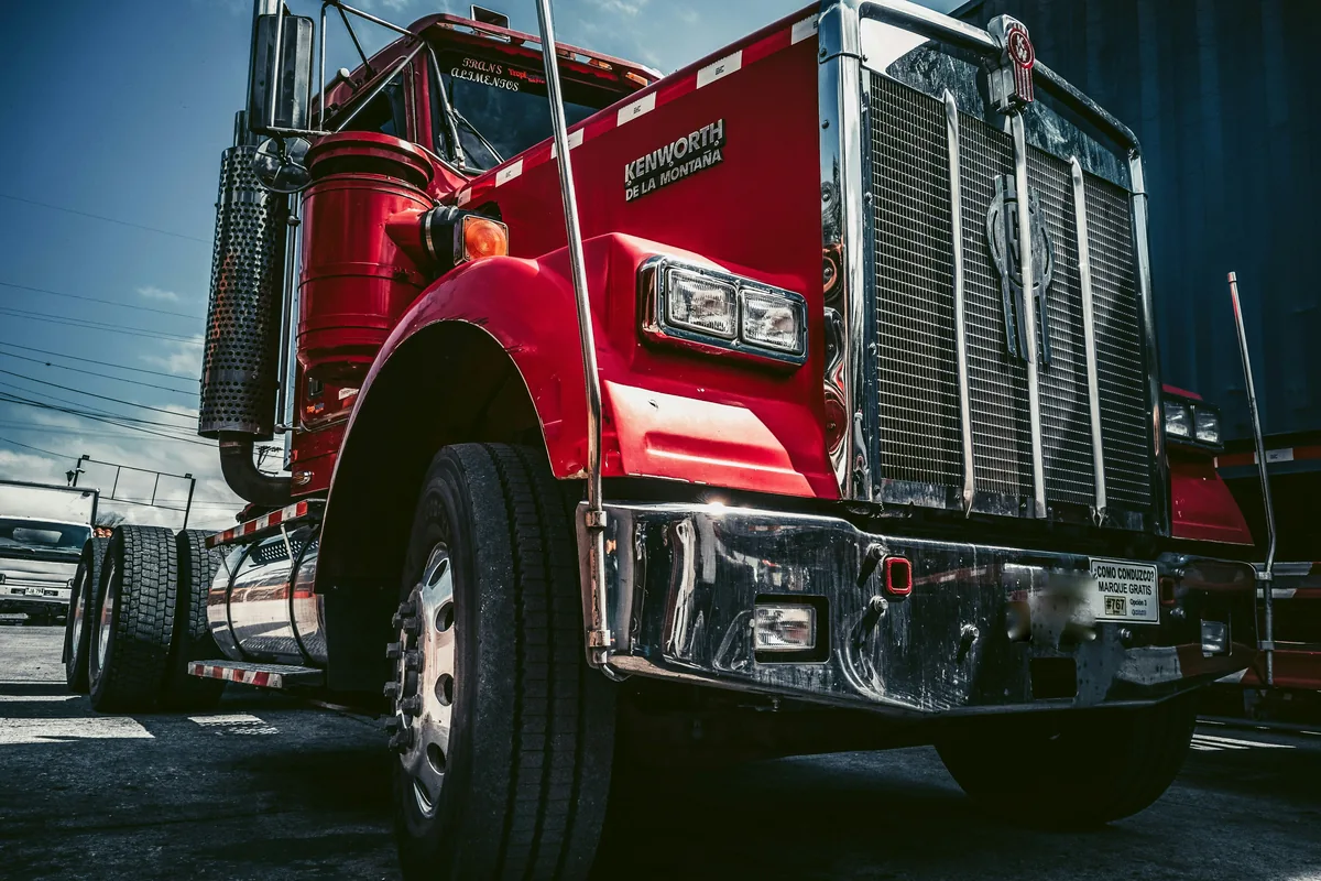 A polished red Kenworth tractor ready to work.